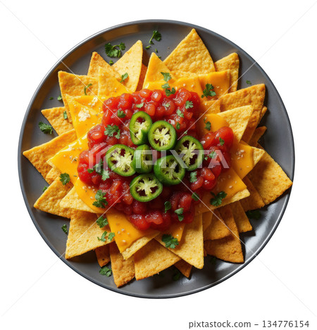Appetizing nacho platter topped with cheese, salsa, and jalapeno. savory corn chip snack on grey plate, top view 134776154