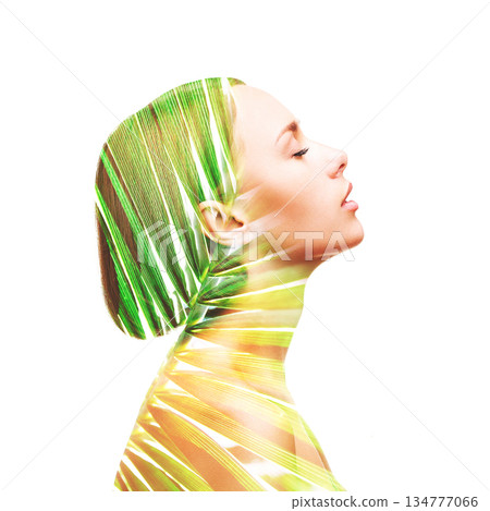Profile beautiful woman and palm leaf Profile beautiful woman and palm leaf 134777066