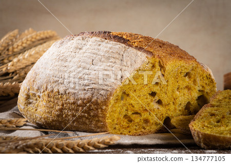 Freshly artisan baked wheat, turmeric and rye bread, country bread. Simple bread for breakfast 134777105