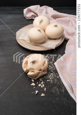 French meringue cookies on slate background French meringue cookies on slate background 134777252