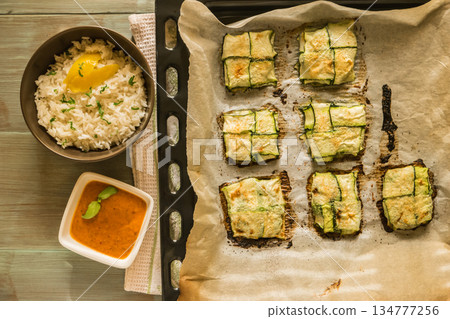 Oven baked courgettes Oven baked courgettes 134777256
