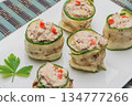 Grilled zucchini rolls with curd cheese and tuna on plate. 134777266
