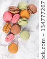 Colorful macaroons on marble background. Sweet macarons. Top view with copy space for your text 134777267