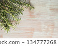 Bunch of fresh of garden rosemary on wooden table, rustic style, fresh organic herbs. Top view with copy space 134777268