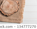 Wood plank board above burlap on wooden table 134777270