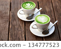 Two cups of matcha latte 134777523