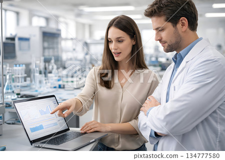 Female researchers sharing results in the technical lab 134777580