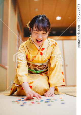 Beautiful young kimono woman with marbles 134777683