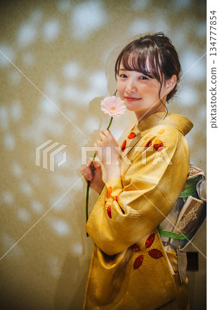 A young lady in kimono A young lady in kimono 134777854
