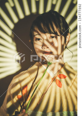 A young lady in kimono A young lady in kimono 134777892