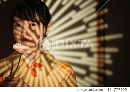 A young lady in kimono A young lady in kimono 134777895