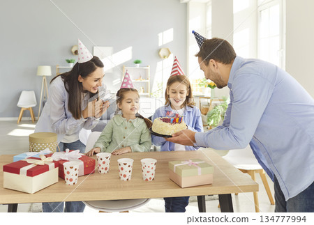Happy Family Celebrating Birthday With Cake And Gifts At Home Happy Family Celebrating Birthday With Cake And Gifts At Home 134777994