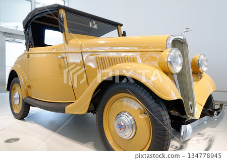 Nissan yellow classic car Nissan yellow classic car 134778945