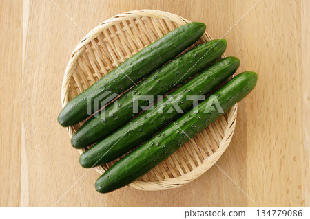Cucumbers in a colander 134779086