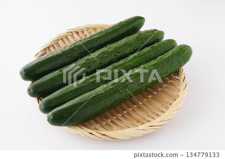 Cucumbers in a colander on a white background 134779133