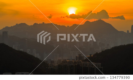 Golden Sunset Over City Skyline Behind Rolling Hills at Dusk Nov 10 2025 Golden Sunset Over City Skyline Behind Rolling Hills at Dusk Nov 10 2025 134779390