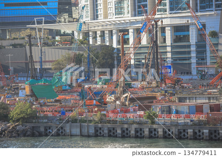 Oct 1 2025 Busy City Construction Site by Waterfront With Cranes and Modern Oct 1 2025 Busy City Construction Site by Waterfront With Cranes and Modern 134779411