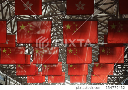 Oct 1 2025 Overhead Chinese Flags Displayed in a Modern Indoor Space Oct 1 2025 Overhead Chinese Flags Displayed in a Modern Indoor Space 134779432