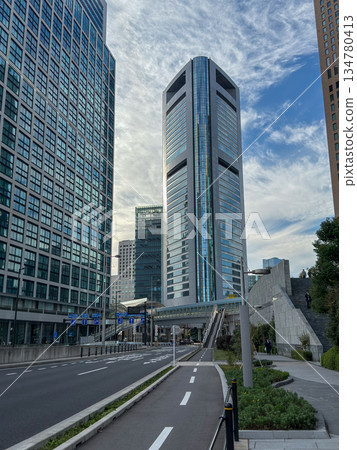 Modern skyscrapers towering against the blue sky and flowing clouds November 2025 Chuo Ward, Japan Modern skyscrapers towering against the blue sky and flowing clouds November 2025 Chuo Ward, Japan 134780413