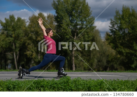 Caucasian woman roller skating in park. Caucasian woman roller skating in park. 134780660