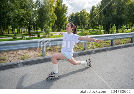 Caucasian woman in shorts roller skating. Caucasian woman in shorts roller skating. 134780662