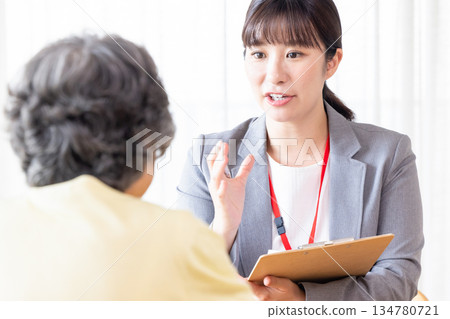 Businesswoman explaining to senior woman Businesswoman explaining to senior woman 134780721