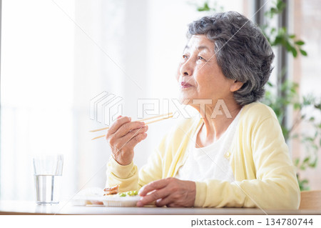 Senior woman to eat Senior woman to eat 134780744