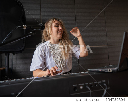 Caucasian woman teaches online music lesson.. Caucasian woman teaches online music lesson.. 134780804