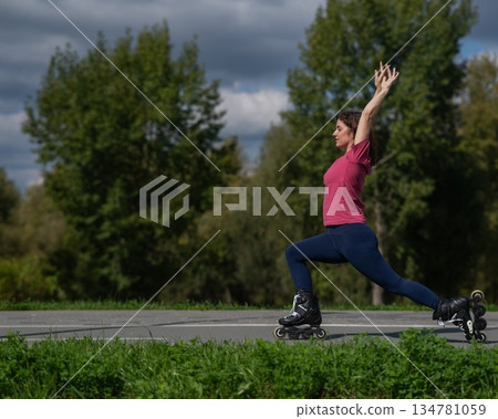 Caucasian woman roller skating in park.  134781059
