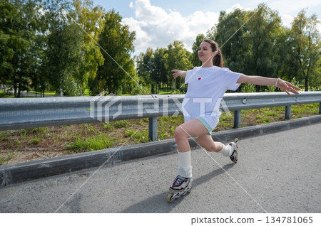 Caucasian woman in shorts roller skating. Caucasian woman in shorts roller skating. 134781065