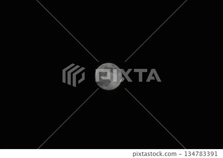 moon floating in the night sky 134783391