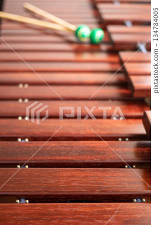 A marimba and the green mallets on top 134784005