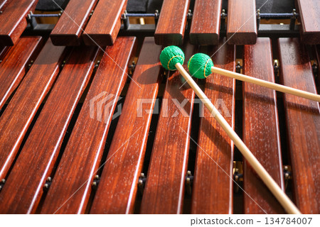 A marimba and the green mallets on top A marimba and the green mallets on top 134784007
