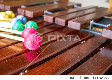 A marimba and colorful mallets placed on top 134784077