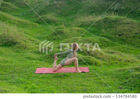 Caucasian woman doing yoga outdoors. Caucasian woman doing yoga outdoors. 134784580
