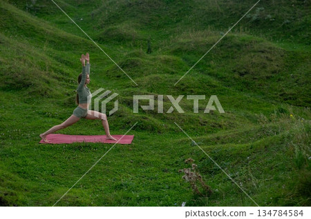 Caucasian woman doing yoga outdoors. Caucasian woman doing yoga outdoors. 134784584