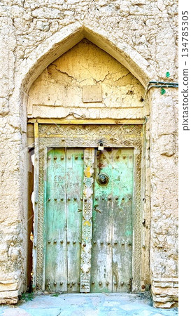 Old Weathered Turquoise Door Scene, Historic Aged Door Showcasing Vibrant Colors And Weathered Charm, Timeworn Turquoise Doorway Featuring Distressed Paint And Vintage Architectural Elements Old Weathered Turquoise Door Scene, Historic Aged Door Showcasing Vibrant Colors And Weathered Charm, Timeworn Turquoise Doorway Featuring Distressed Paint And Vintage Architectural Elements 134785305