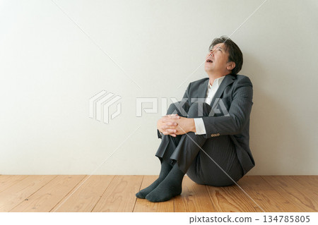 Worried middle-aged businessman 134785805