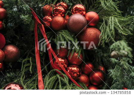 Festive Christmas Tree Decorated with Red Baubles and Ribbons. High quality photo Festive Christmas Tree Decorated with Red Baubles and Ribbons. High quality photo 134785858
