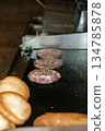 Beef Burger Patties Grilling on a Professional Flat Top Griddle. High quality photo 134785878
