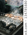 Meat Skewers Grilling on Charcoal Mangal with Smoke. High quality photo 134785880