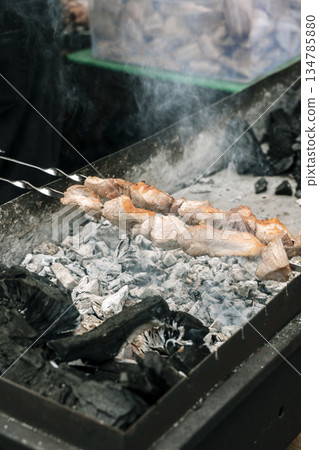 Meat Skewers Grilling on Charcoal Mangal with Smoke. High quality photo 134785880