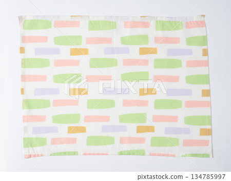 White placemat with warm colored tile pattern White placemat with warm colored tile pattern 134785997