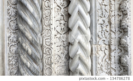 Ornate italian romanesque marble carving with twisted column details Ornate italian romanesque marble carving with twisted column details 134786278