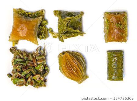 Assortment of turkish baklava pastries with chopped pistachio Assortment of turkish baklava pastries with chopped pistachio 134786302