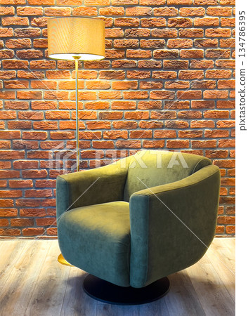 Green armchair in loft interior against brick wall Green armchair in loft interior against brick wall 134786395