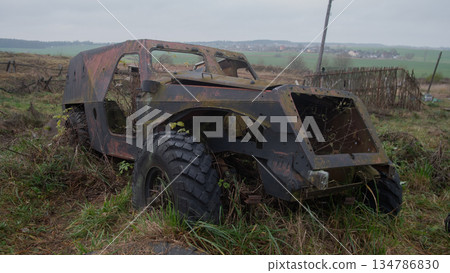 rusty armored vehicle stranded in meadow, large heavy tire half-buried in mud, open engine bay, peeling paint, rusty armored vehicle stranded in meadow, large heavy tire half-buried in mud, open engine bay, peeling paint, 134786830