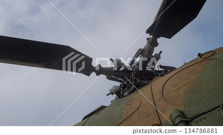 detailed helicopter rotor articulation and linkage against pale sky, visible bolts and pivots, grease traces, detailed helicopter rotor articulation and linkage against pale sky, visible bolts and pivots, grease traces, 134786881
