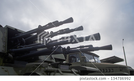 muzzle brake detail showing star insignia and worn paint, tight crop captures surface texture, rivets 134786992