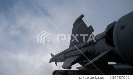 low-angle missile wing against overcast sky, technical detail emphasizing engineering and readiness; metal 134787061